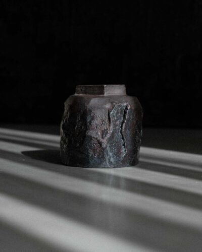 Hand-crafted Ondou Kurinuki Cup Nº1 made from black stoneware in a dramatic contrasted light.